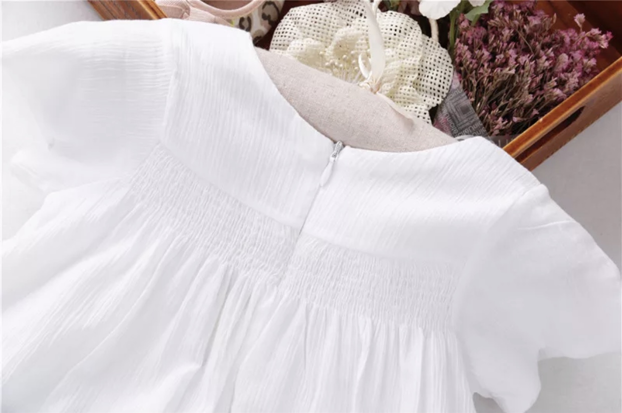 Classic White Cotton Top With Floral Smocking - Image 3